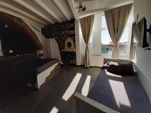 a bedroom with a bed and a large window at 5 TERRE PELAGOS 2 in Manarola