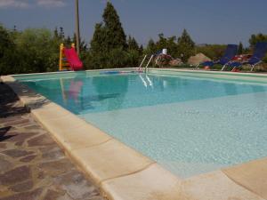a swimming pool with a slide and a playground at Villa Franca in Pula