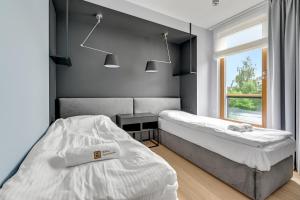 Posteľ alebo postele v izbe v ubytovaní Nadmorski Park Premium