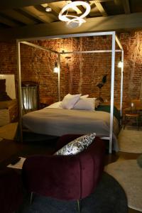 
a bedroom with a large bed and a large window at De Pelsertoren in Zwolle
