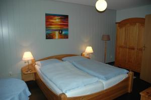 Postel nebo postele na pokoji v ubytování Hotel Kappelner Hof