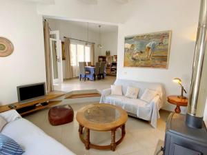 a living room with a couch and a table at Boscimar in Sant Lluis