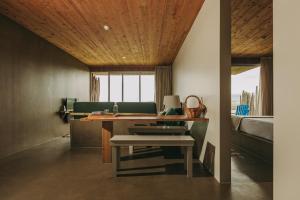 a room with a desk with a sink and a bed at Santa Barbara Eco-Beach Resort in Ribeira Grande