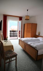 Postel nebo postele na pokoji v ubytování Garni Marianne + 15 fotografií