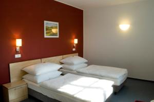 Posteľ alebo postele v izbe v ubytovaní Hotel Chvalská Tvrz