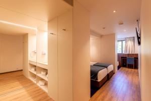 Кровать или кровати в номере Sea Porto Hotel