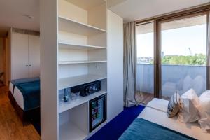 Кровать или кровати в номере Sea Porto Hotel