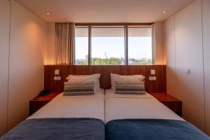 Кровать или кровати в номере Sea Porto Hotel