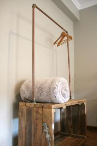 a wooden box with a pillow on top of it at Avo&Oak Guesthouse in George
