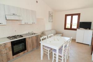 A kitchen or kitchenette at Corte di Gallura