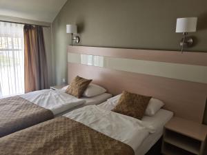 Posteľ alebo postele v izbe v ubytovaní Apartament Czarna Góra S6