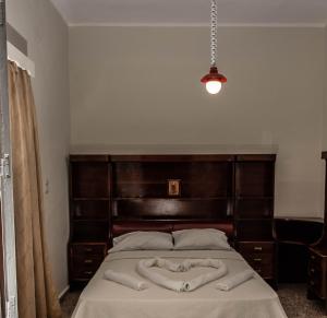 מיטה או מיטות בחדר ב-Reina House