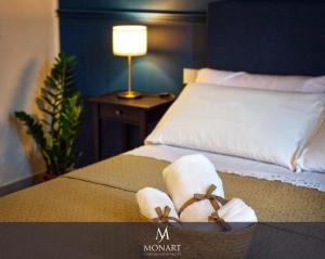A bed or beds in a room at MONART HOSPITALITY Cavour