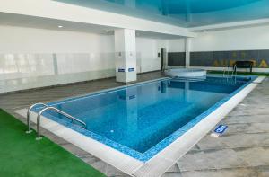a large swimming pool in a building at Villa Aurora in St. St. Constantine and Helena