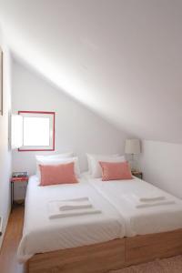 Postel nebo postele na pokoji v ubytování Maria Tereza Sea Villa