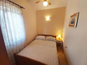 Postel nebo postele na pokoji v ubytování Apartments Carmen Vinisce