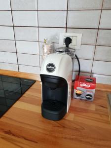 a coffee maker sitting on top of a counter at Dua Apartments in Shëngjin