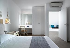 Ein Bett oder Betten in einem Zimmer der Unterkunft Santa Maria Luxury Suites & Spa
