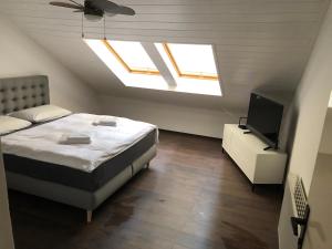 Postel nebo postele na pokoji v ubytování Apartman Kryštof
