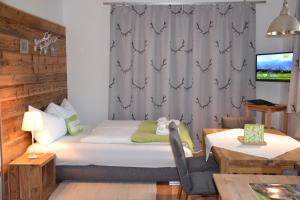 Posteľ alebo postele v izbe v ubytovaní Appartement - das kleine Bleiberger by Schladmingurlaub