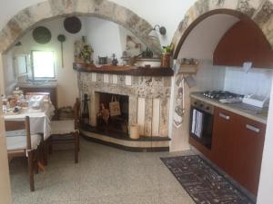 Kjøkken eller kjøkkenkrok på Il Trullo di Nonno Angelo San Marco