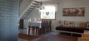 a dining room with a table and chairs at Topin Tupa 1 in Oravisalo