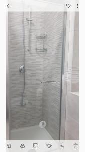 a shower with a glass door in a bathroom at Raggio di sole in Rocca Imperiale