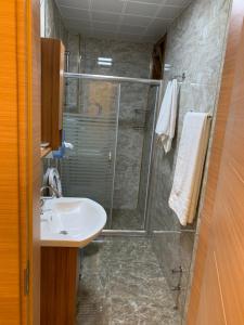 a bathroom with a shower and a sink at Danis Motel in Uzungöl