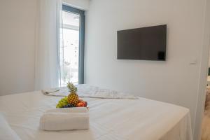 Televízia a/alebo spoločenská miestnosť v ubytovaní Golden Luxury Apartment