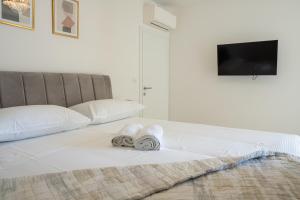 Posteľ alebo postele v izbe v ubytovaní Golden Luxury Apartment
