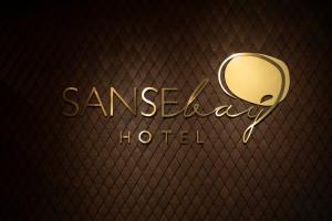 a gold sign that reads sameday hi used at Hotel SANSEbay in Donostia-San Sebastián