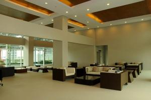 a lobby with couches and chairs in a building at Affordable Makati Serviced Apartments in Manila +100 photos