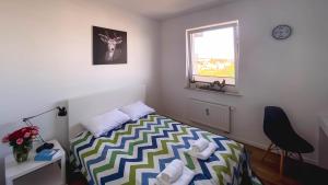 Postel nebo postele na pokoji v ubytování Apartament Naturalny-Lake Apartments, osiedle Calamo Park-Olsztyn