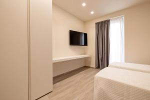 TV a/nebo společenská místnost v ubytování Aria di Mare Apartments