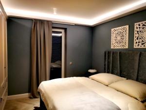 Postel nebo postele na pokoji v ubytování Fűzliget Mangó Terrace