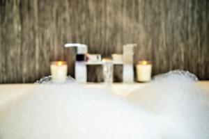 a bathroom with a sink and some candles at The Orchards in Kendal