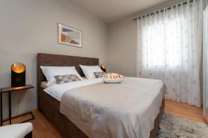 Postel nebo postele na pokoji v ubytování Apartments Prince