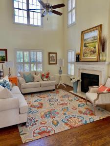 a living room with two couches and a fireplace at Suite Melissa's Pinehurst Country Club #6 Private Room and Bath in Pinehurst