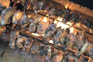 a bunch of food cooking on a grill at Agriturismo dell'Altopiano in Serle