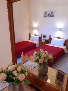 Postel nebo postele na pokoji v ubytování Hotel Anagennisis