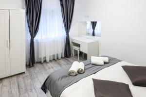 Ένα ή περισσότερα κρεβάτια σε δωμάτιο στο Cristopher Apartament