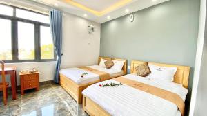 Postel nebo postele na pokoji v ubytování Gao Hotel