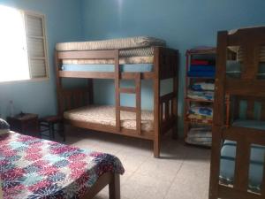 En eller flere senge i et værelse på Casa Ubatuba Centro