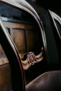 a close up of the armrest of a chair at The Old Confectionery in Oamaru