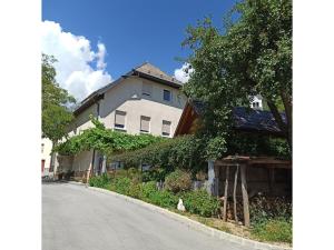 a house on the side of a road at Apartment Nevela in Bovec