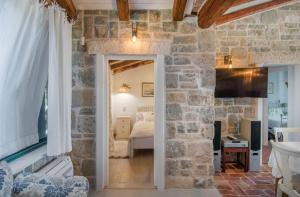 Postel nebo postele na pokoji v ubytování Villa Manda Korina