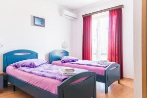 Posteľ alebo postele v izbe v ubytovaní Lovely House LINDI in Poreč