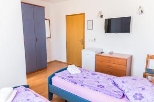 Posteľ alebo postele v izbe v ubytovaní Lovely House LINDI in Poreč
