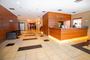 a lobby of a hotel with a reception desk at Premium Hotel Bacero Wrocław in Wrocław