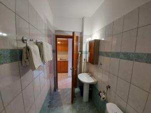 a bathroom with a sink and a toilet at Apocalypsis Studios-Apartments in Psakoudia